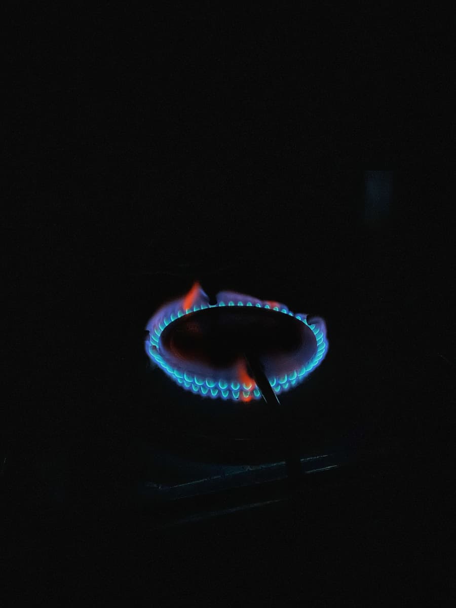 Blue gas flame ring glowing in the dark